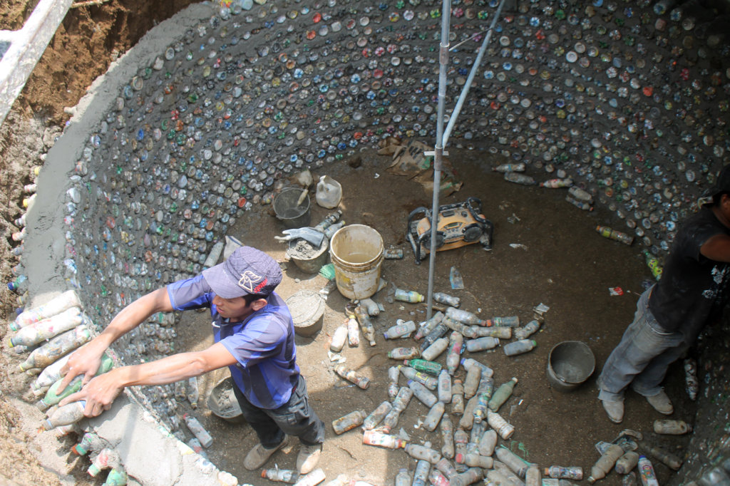 Students building with eco-bricks