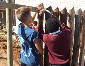 Buddies at work putting up the fence