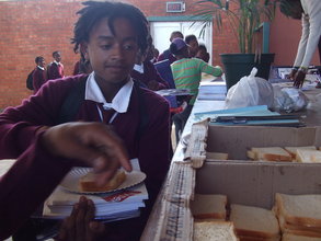 Bongani collecting sandwiches for lunch