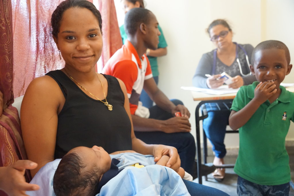 Mother and infant being treated at clinic.