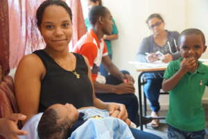 Mother and infant being treated at clinic.
