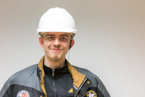Aaron is proud and happy at his new job!