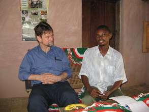 A student meets with a visiting scientist
