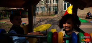 Ilia and Karina are playing in orphanage