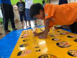 Picture 3: Adding a Special Tough to His Drawing