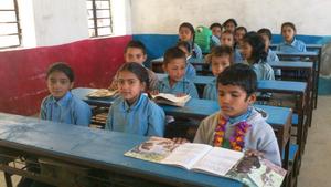 Students in Nepal share long desks and benches