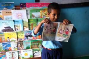Student at Shree Laliguras School reads to friends