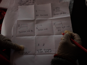 A teacher works on her storyboard during training