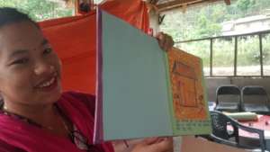 Anjita reads her book about snow at the workshop.