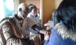 Clinic staff attend to an elder at Old Age Club