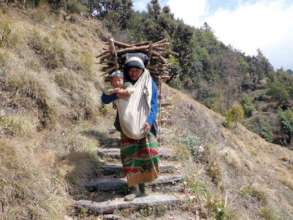 Mother and baby collecting firewood.