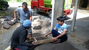 Sieving the volcanic sand ready for concreting