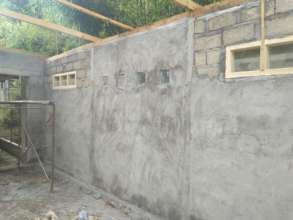 Windows in place and walls plastered