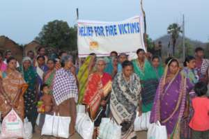 Providing Food packets to the fire victims