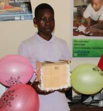 Mama proudly showing his egg drop project