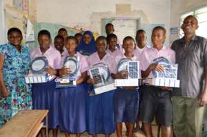 Students receiving the solar lamps