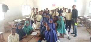 Komora with students in class