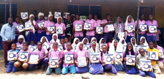 Ozi Primary Students with Solar Lanterns