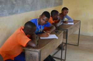 Volunteers interviewing students