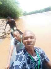 TRLF Staff crossing River Tana by canoe