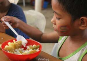 Distribution of healthy soup to street children.