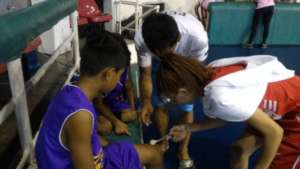 Junior Health Workers providing first aid