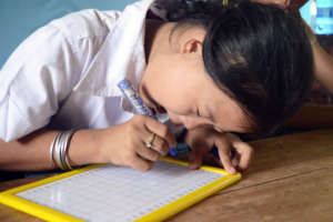 Top student writing with care