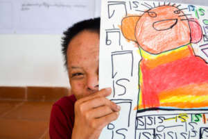 SEP student proud of his colourful drawing