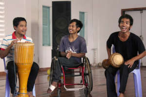 IAC students jam together on the drums