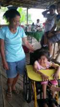 AAI beneficiary child with Mom at treatment center