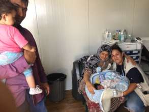 Aishagol with her parents & IsraAID nurse Ionna