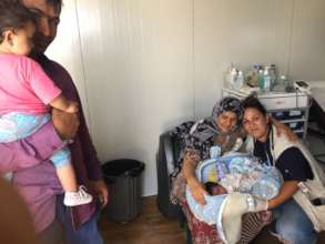 Aishagol with her parents & IsraAID nurse Ionna