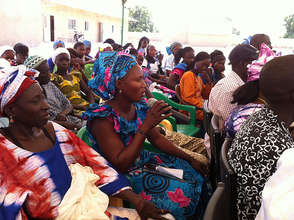 Community members discuss girls' education.
