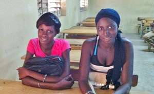 Mbarou, right, with a classmate.