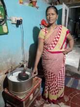 Woman selling rice batter through microfinance