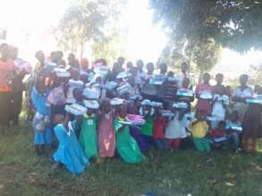 Children receive books to enable them continue sch