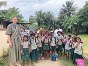 Children interacting with volunteer