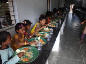 Children with water during mid-day meal