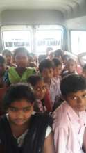 Children happily coming to centre from home by van