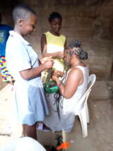 Girls learning hairdressing