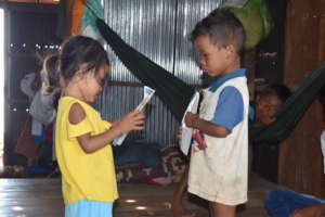 Two of the kids perusing SHCH education pamphlets