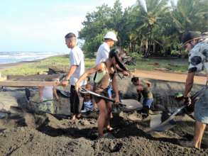 Volunteers, staff and locals preparing a hatchery