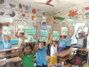 Children with their copies of revamped syllabus