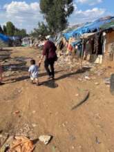 Vinita with a child at the WPC