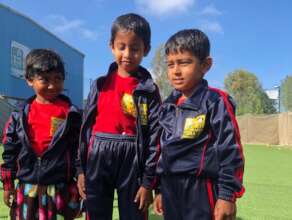 Children sporting their sports outfits.