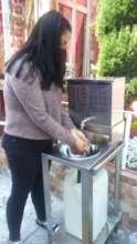 Juli uses a new public handwashing station from us