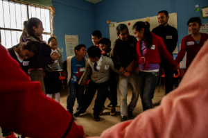 Girls and boys learning to play together