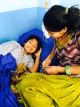 Sunita with Staff Member in Hospital