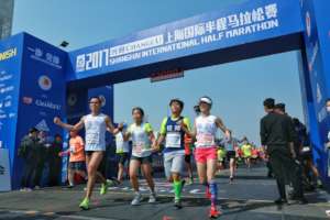 Cross line as a team in half marathon