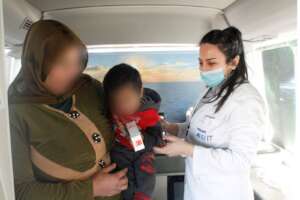 Mother and baby receiving medication